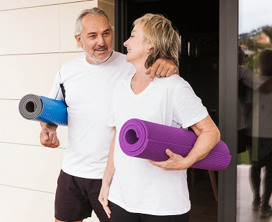 senior couple excising garden